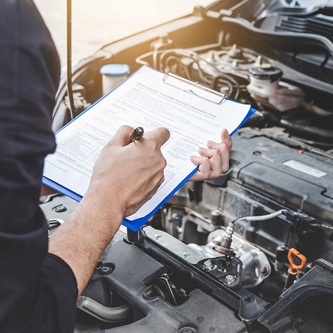 Mechanic checking and servicing a vehicle - Car Service Greenwich