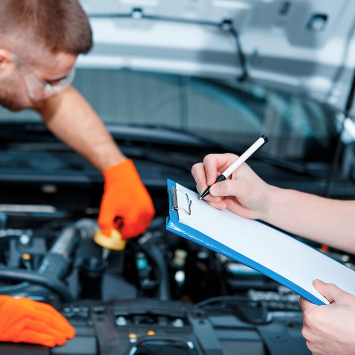 Mechanics doing an MOT - MOT Greenwich